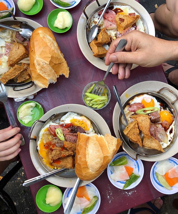Food Tours in Vietnam - How to Experience the Best Food Tours in Vietnam Banh mi chao (bread with combo pan) at Hoa Ma in Saigon, Vietnam