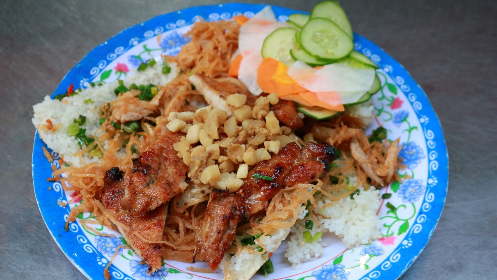 Food Tours in Vietnam - How to Experience the Best Food Tours in Vietnam Street food "Com Chay Suon" in Ho Chi Minh City, Vietnam.