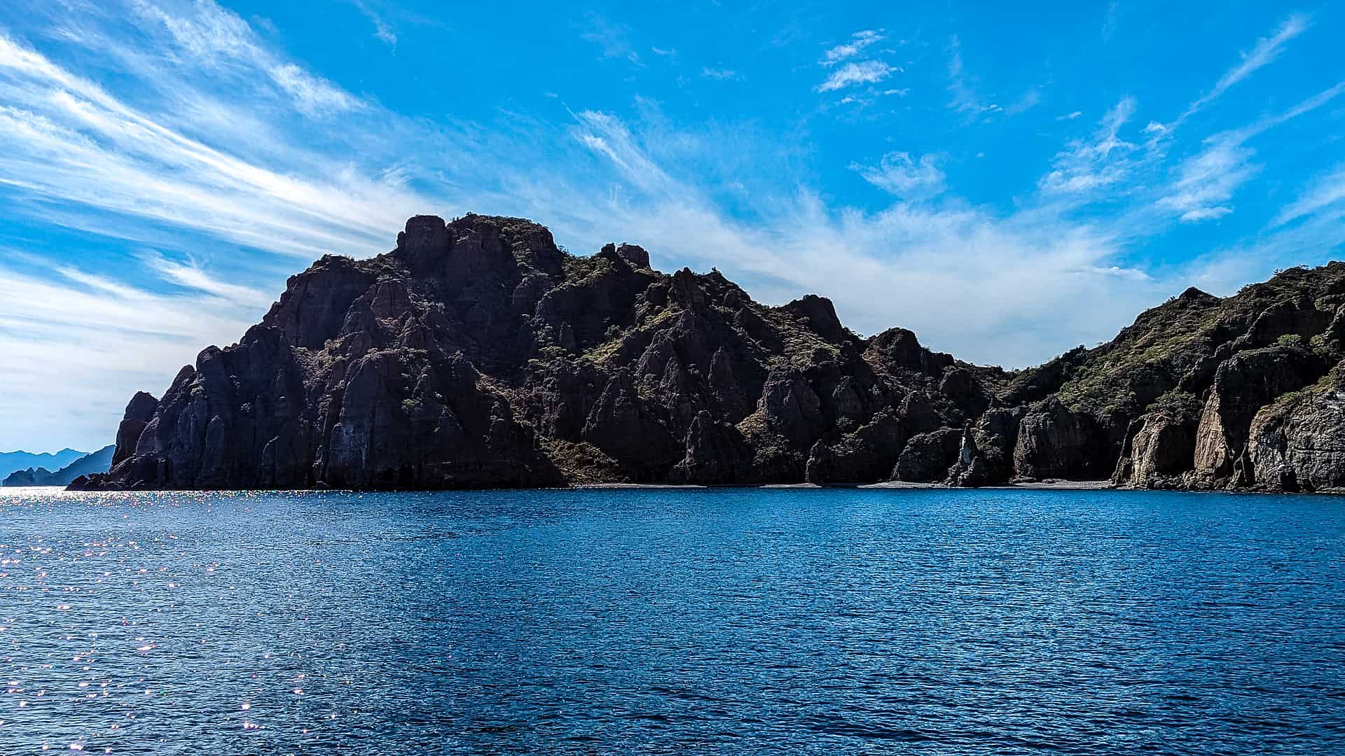 Honeymoon Beach in Baja California Sur - Discovering the Hidden Gem of Honeymoon Beach in Baja California Sur Rough and beautiful coastline of Isla Danzante in Baja California Sur, Mexico.