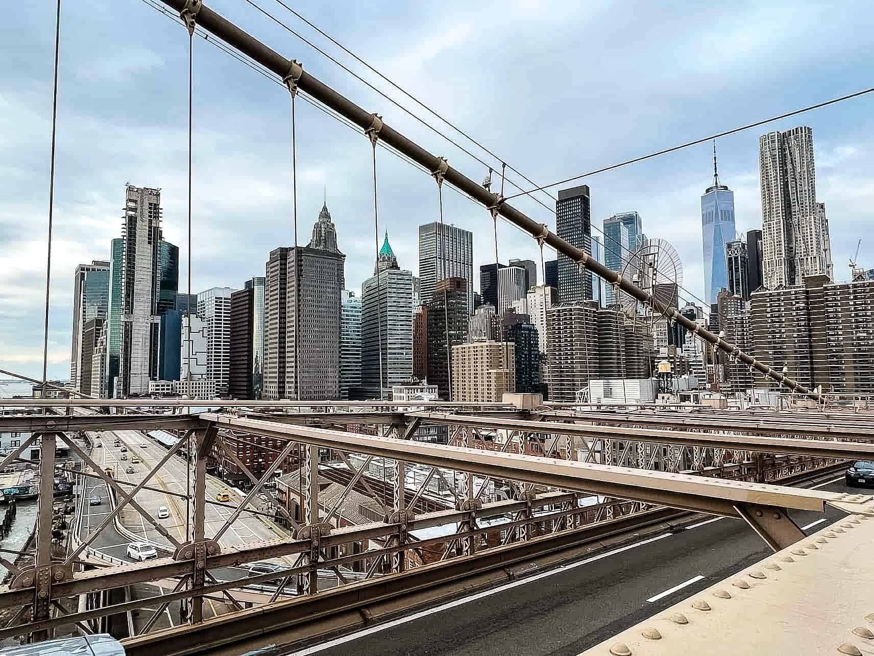 New York City in Winter - A Guide to Visiting New York City in Winter Skyline view from the bridge - Brooklyn Bridge in New York City, USA.