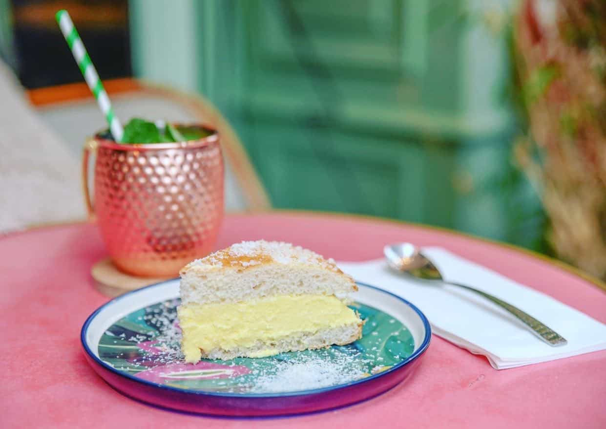visit the Louvre - What Is the Best Way To Visit the Louvre? Tarte tropézienne with cocktail at the Cafe Saint Honore in Paris, France.